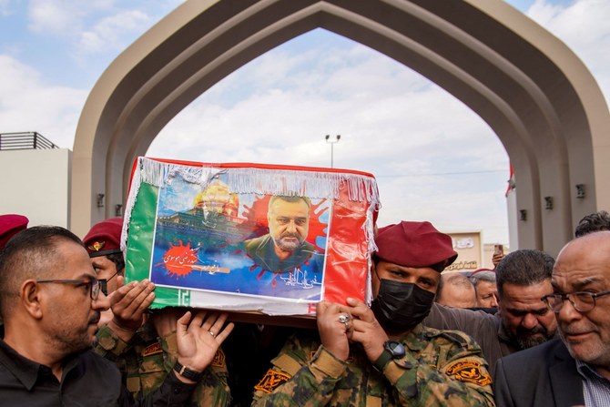 Mourners carry the coffin of Razi Moussavi, a senior commander in the Quds Force of Iran's Islamic Revolutionary Guard Corps (IRGC) who was killed on December 25 in an Israeli strike in Syria (AFP)