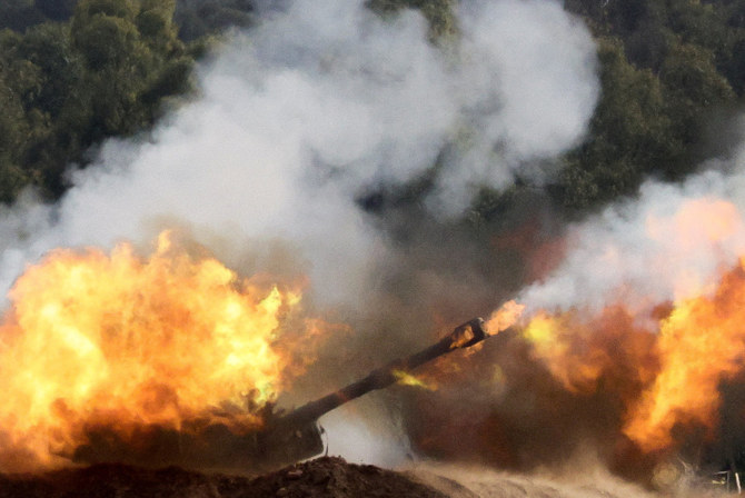 An Israeli artillery unit fires near the Israel-Gaza border on December 27, 2023, amid the ongoing conflict between Israel and the Palestinian Islamist group Hamas. (Reuters)