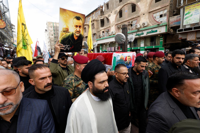 People carry the coffin of senior adviser for Iran's Revolutionary Guards, Sayyed Razi Mousavi, who was killed in an Israeli air strike outside the Syrian capital Damascus, during his funeral in Najaf, Iraq. (Reuters)
