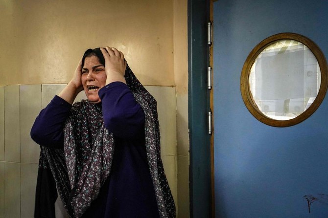 A woman mourns a loved one killed during Israeli bombardment at Nasser Hospital on the southern Gaza Strip amid continuing battles between Israel and the Palestinian militant group Hamas. (AFP)