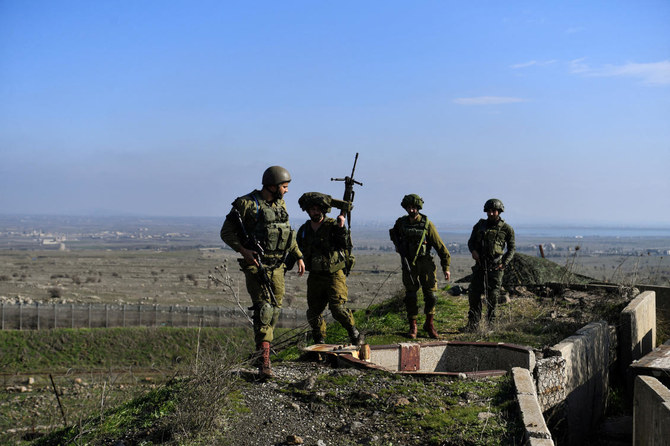 Israeli soldiers operate in the Israeli-occupied Golan Heights near the border with Syria, amid the ongoing conflict between Israel and the Palestinian Islamist group Hamas (REUTERS)