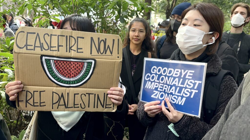One demonstrator told Arab News Japan that they had planned to stand facing the embassy's main gate, but the police prevented them and only allowed them a spot on the side street of the compound. (ANJ)