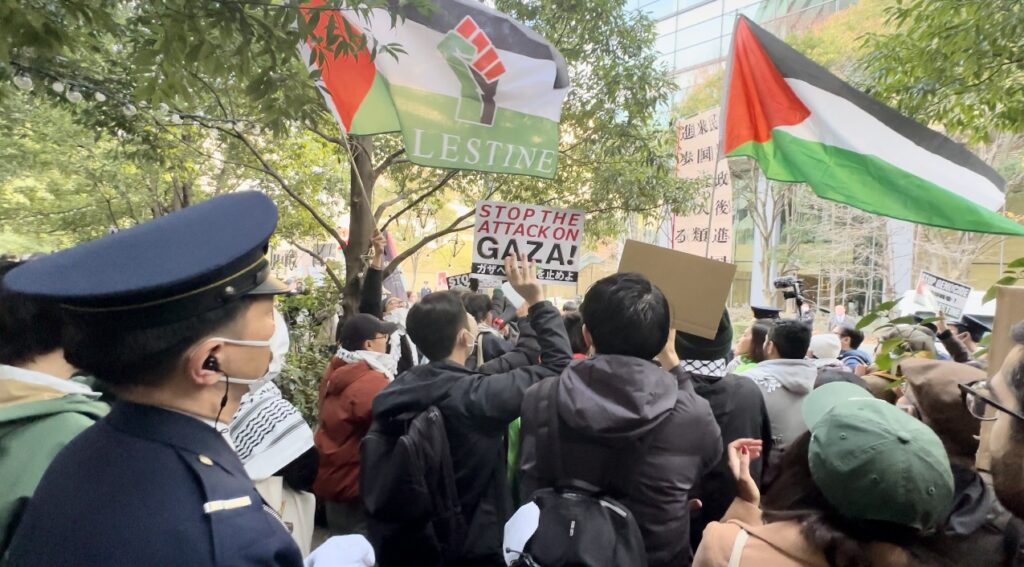 One demonstrator told Arab News Japan that they had planned to stand facing the embassy's main gate, but the police prevented them and only allowed them a spot on the side street of the compound. (ANJ)