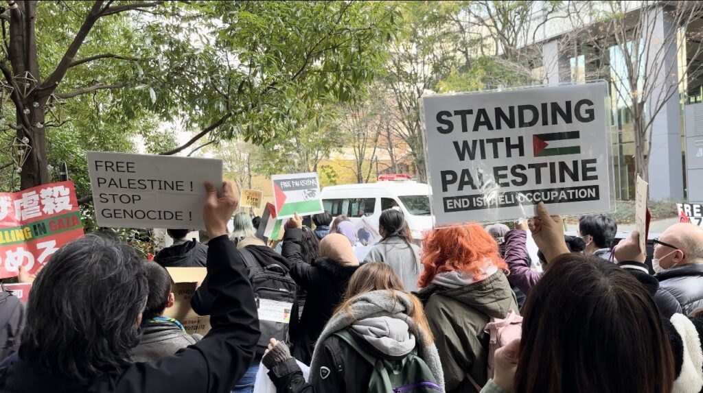 One demonstrator told Arab News Japan that they had planned to stand facing the embassy's main gate, but the police prevented them and only allowed them a spot on the side street of the compound. (ANJ)