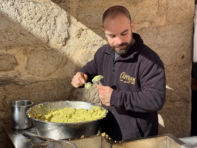 Fourth generation co-owner of Restaurant Afteem, Ala'a Salameh, 42, makes falafel in Bethlehem, in the Israeli-occupied West Bank, December 9, 2023. (Reuters)