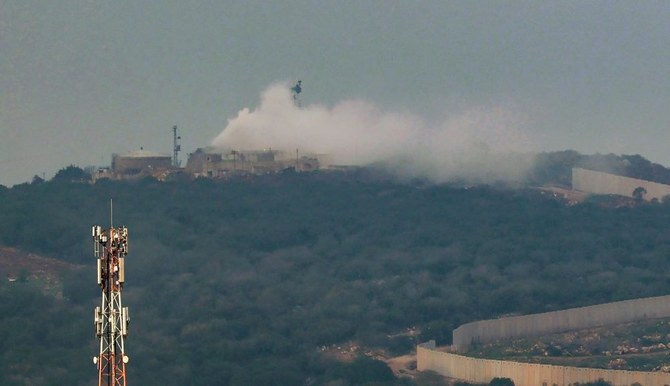 Smoke billows from a Israeli army post after it was hit by a rocket fired from Lebanon, Dec. 12, 2023. (AFP)
