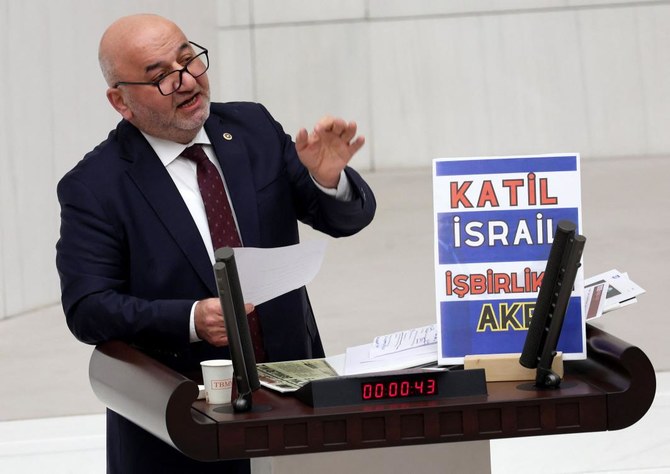 Felicity Party (Saadet) Deputy Hasan Bitmez delivers a speech on the 2024 Ministry of Justice and Ministry of Internal Affairs budget shortly before collapsing in the Turkish Grand National Assembly in Ankara on Dec. 12, 2023. (AFP)