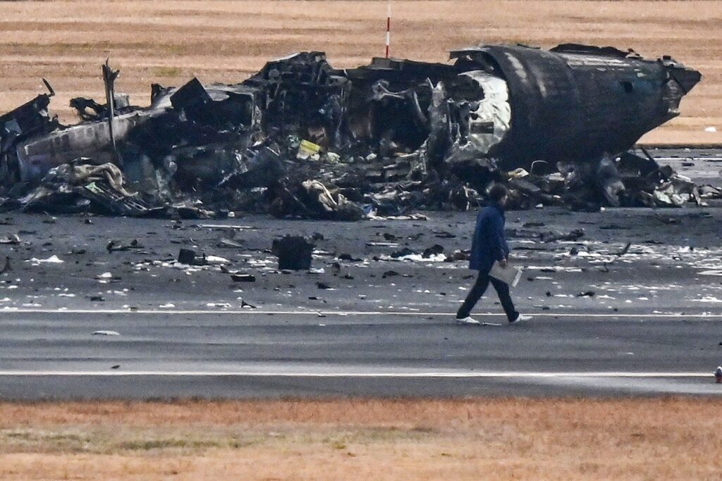 The Japan Airlines pilots in the cockpit did not know about the fire until being informed by the cabin crew. (AFP)