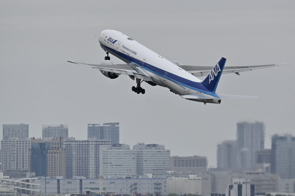 The incident prompted pilots of the plane with 159 passengers on board to turn back over the Pacific to Haneda airport, where the man was handed over to police, according to ANA. (AFP)
