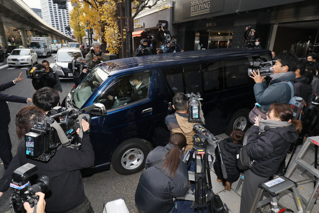 A vehicle of the Tokyo District Public Prosecutors Office leaves a building where the office of Seiwa Policy Research Group, the largest faction of the ruling Liberal Democratic Party (LDP), is located in Tokyo on Decmeber 19, 2023. (AFP)