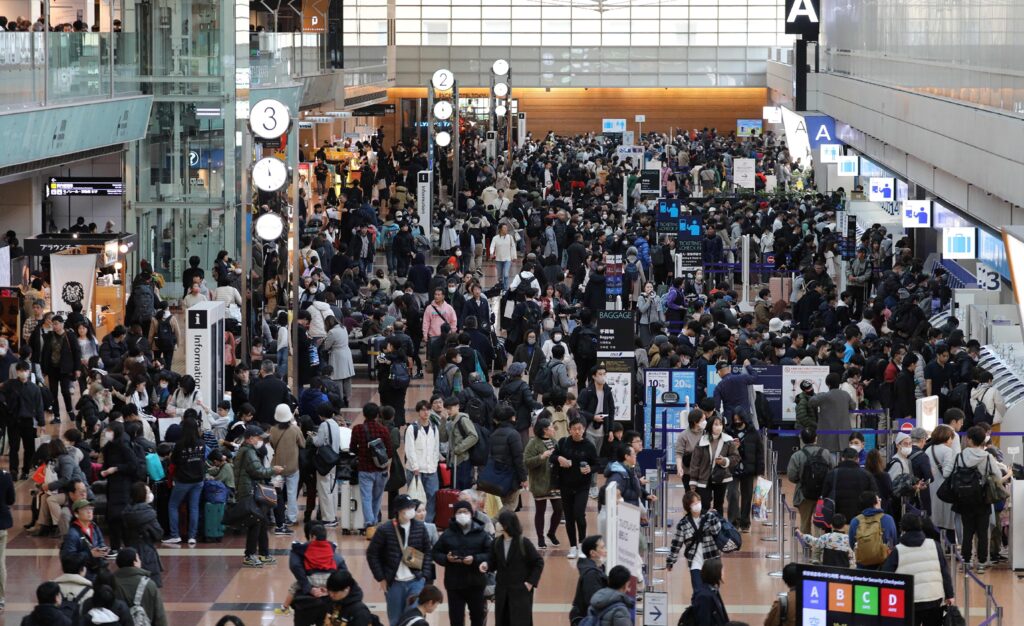 Part of the airport's runways remains closed following the collision between a Japan Airlines passenger jet and a Japan Coast Guard aircraft. (AFP)