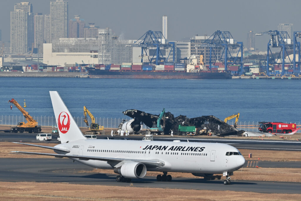The airport's Runway C was reopened after the wreckage of a Japan Airlines passenger jet and a Japan Coast Guard aircraft was removed. (AFP)