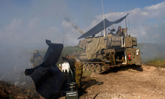 An Israeli tank shells southern Lebanon from a position in the Upper Galillee in northern Israel on January 4, 2024. (AFP)