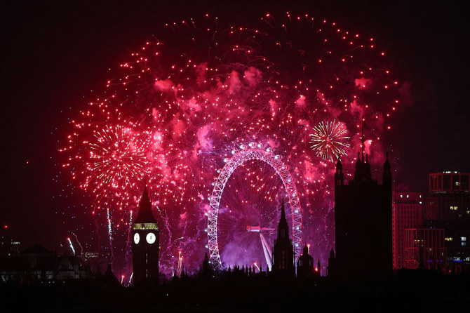 Fireworks explode around the London Eye and The Elizabeth Tower at the Palace of Westminster, home to the Houses of Parliament in London, just after midnight on January 1, 2024. (AFP)