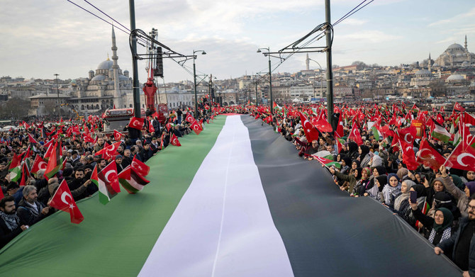 Thousands demonstrate to show solidarity with the Palestinian people amid the ongoing war between Israel and the Palestinian Hamas group in the Gaza enclave, at the Galata Bridge in Istanbul on January 1, 2024. (AFP)
