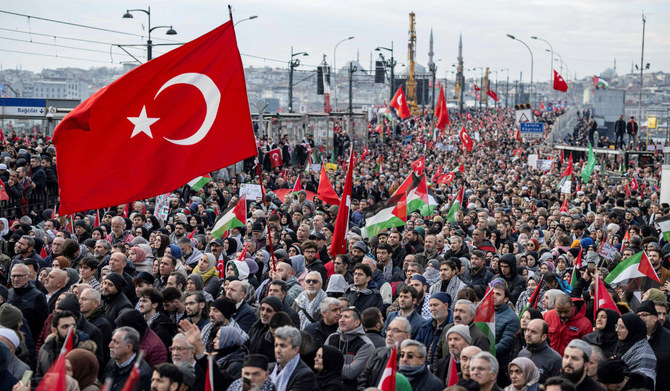 Thousands demonstrate to show solidarity with the Palestinian people amid the ongoing war between Israel and the Palestinian Hamas group in the Gaza enclave, at the Galata Bridge in Istanbul on January 1, 2024. (AFP)