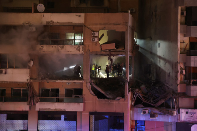 People gather near a damaged site following an explosion at the Beirut suburb of Dahiyeh, Lebanon January 2, 2024. (Reuters)