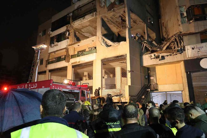 Lebanese emergency responders gather at the site of a strike targeting a Hamas office, in the southern suburb of Beirut on January 2, 2024. (AFP)