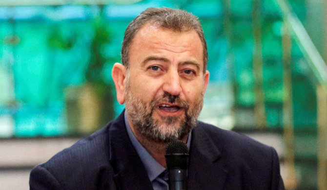 Head of Hamas delegation Saleh al-Arouri speaks as he attends a news conference with Fatah leader Azzam Ahmad after a reconciliation deal signing ceremony in Cairo, Egypt, October 12, 2017. (REUTERS)