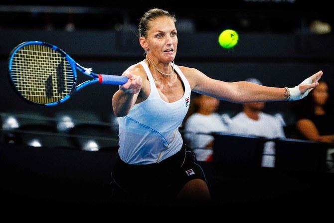 Karolina Pliskova of the Czech Republic hits a return during her women's singles match against Naomi Osaka of Japan at the Brisbane International tennis tournament in Brisbane on Jan. 3, 2024. (AFP)