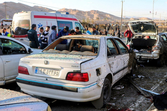 People gather at the scene of explosions during a ceremony held to mark the death of late Iranian General Qassem Soleimani, in Kerman, Iran, Jan. 3, 2024. (Reuters)
