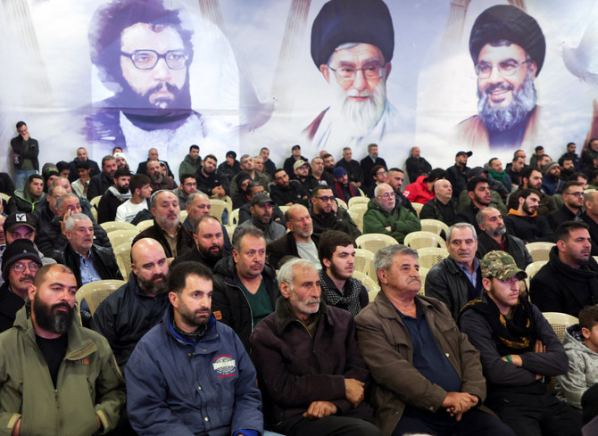 Lebanon's Hezbollah supporters listen to their leader Sayyed Hassan Nasrallah giving a televised address in Baalbek, Lebanon, on January 5, 2024. (REUTERS)
