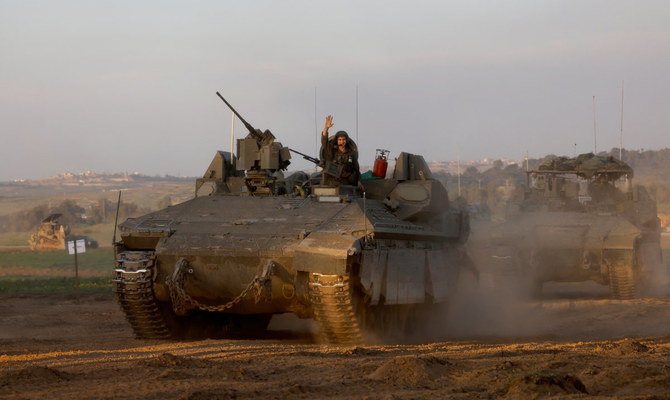 A convoy of Israeli military vehicles manoeuver near the Israel-Gaza border, amid the ongoing conflict between Israel and the Palestinian Islamist group Hamas, in Israel, January 6, 2024. (Reuters)