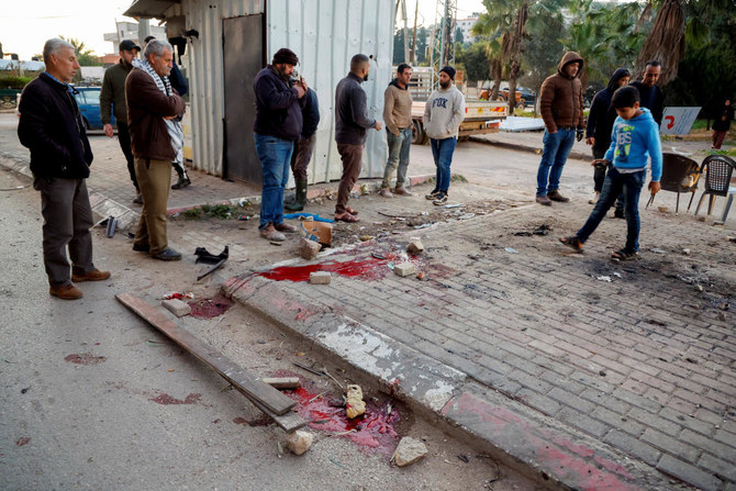 Palestinians check the site where an Israeli air strike killed six men, near Jenin in the Israeli-occupied West Bank (REUTERS)