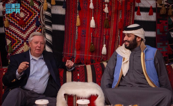 Saudi Arabia’s Crown Prince Mohammed bin Salman receives US Senator Lindsey Graham at the Winter Camp in AlUla on Sunday. (SPA)