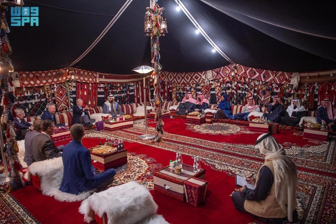 Saudi Arabia’s Crown Prince Mohammed bin Salman receives US Senator Lindsey Graham at the Winter Camp in AlUla on Sunday. (SPA)