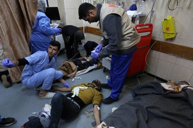 People injured in an Israeli bombardment receive medical care at the emergency ward of the al-Aqsa hospital in Deir al-Balah in the central Gaza Strip (AFP)