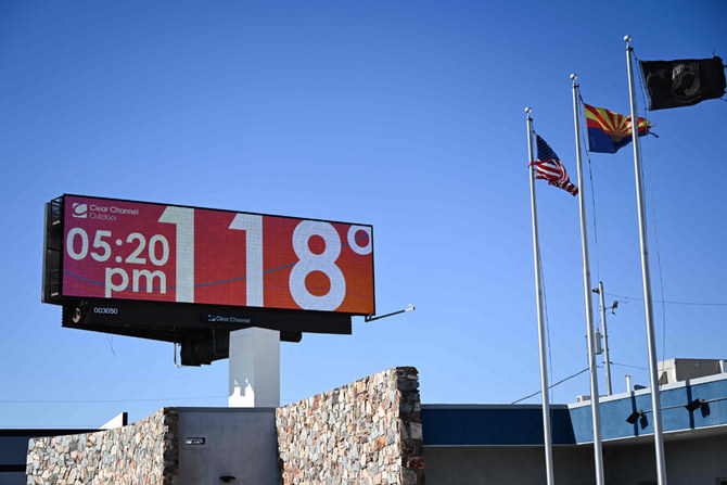 A billboard displays a temperature of 118 degrees Fahrenheit (48 degrees Celsius) during a record heat wave in Phoenix, Arizona on July 18, 2023. (AFP) Phoenix, Arizona, (AFP)