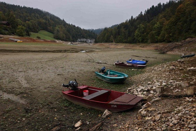 Small boats washed up on the banks of the Villers-le-Lac basins, eastern France, on October 4, 2023. (AFP)