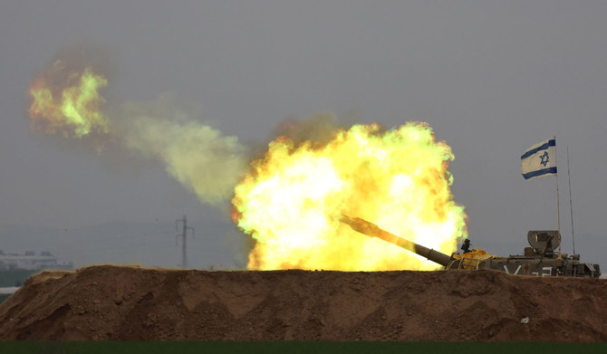 A picture taken in southern Israel near the border with the Gaza Strip on December 21, 2023, shows an Israeli artillery firing towards Gaza amid continuing battles between Israel and the militant group Hamas. (AFP)