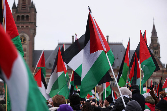Pro-Palestinian protesters gather near the International Court of Justice (ICJ), in The Hague, Netherlands January 12, 2024. (Reuters)
