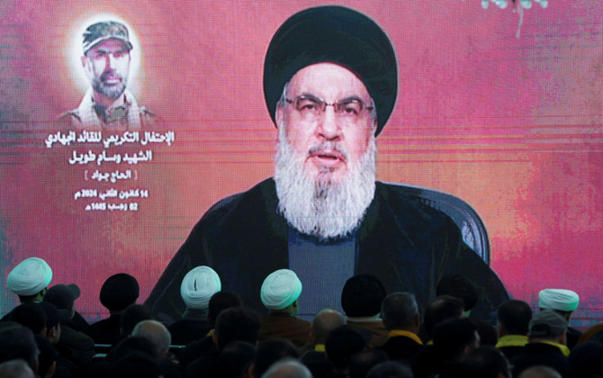Lebanon's Hezbollah leader Sayyed Hassan Nasrallah gives a televised address at a memorial ceremony to mark one week since the killing of Wissam Tawil, a commander of Hezbollah's elite Radwan forces, in Khirbet Silem, southern Lebanon, January 14, 2024. (REUTERS)