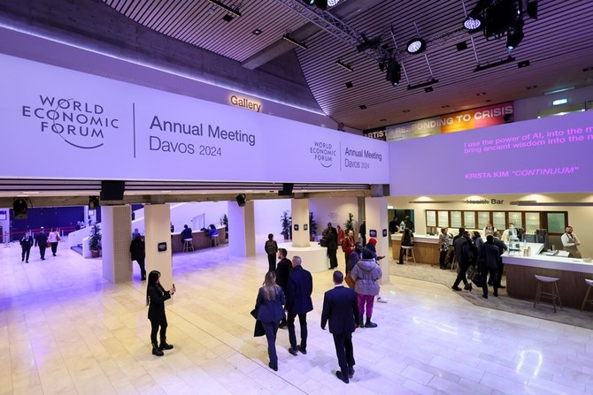 People walk inside the venue, on the first day of the annual meeting in Davos, Switzerland, January 15, 2024. (Reuters)