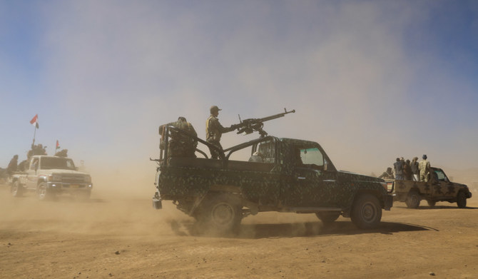 Pick-up trucks carrying Houthi policemen and tribal supporters of the group parade during a protest against recent US-led strikes on Houthi targets, near Sanaa, Yemen January 14, 2024. (REUTERS)