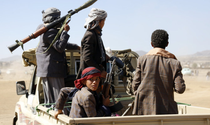 Houthi fighters and tribesmen stage a rally against the US and the UK strikes on Houthi-run military sites near Sanaa, Yemen, Jan. 14, 2024. (AP)