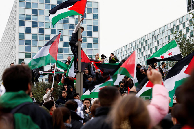 People protest in support of Palestinians in Gaza as the conflict between Israel and Hamas continues, at the headquarters of the International Criminal Court (ICC), which has ongoing investigations into potential atrocity crimes carried out by Hamas in Israel, and by Israelis in the Gaza Strip (Reuters)