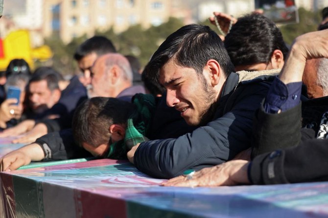 Mourners in Tehran attend the funeral of three Iranian Revolutionary Guard Corps (IRGC) members killed in Damascus in a strike blamed on Israel. (AFP)