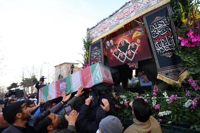 Mourners in Tehran attend the funeral of three Iranian Revolutionary Guard Corps (IRGC) members killed in Damascus in a strike blamed on Israel. (AFP)