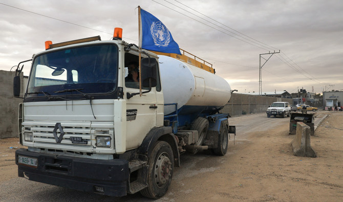 A truck carrying fuel decorated with a UN flag crosses into Rafah in the southern Gaza Strip on November 15, 2023. (AFP/File)