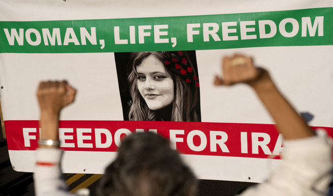 Demonstrators chant slogans while marching during the “March of Solidarity for Iran” in Washington, DC, on October 15, 2022. (AFP/File)