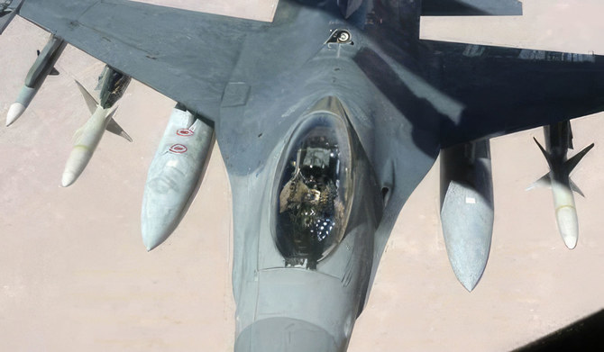 In this image provided by the US Air Force, Lt. Col. CQ Brown, Jr., pilots an F-16 Fighting Falcon in support of Operation Southern Watch, Iraq, in the early 2000s. (AP)