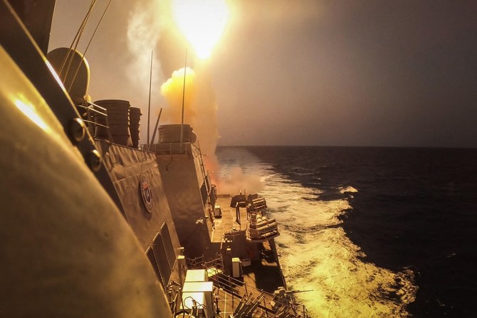 File photo shows the Arleigh Burke-class guided-missile destroyer USS Carney (DDG 64) defeating a combination of Houthi missiles and unmanned aerial vehicles in the Red Sea (AFP)