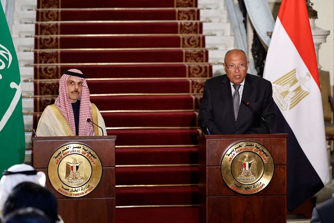 Egypt’s Foreign Minister Sameh Shoukry and his Saudi counterpart Prince Faisal bin Farhan give a press conference in Cairo on Jan. 28, 2024. (AFP)