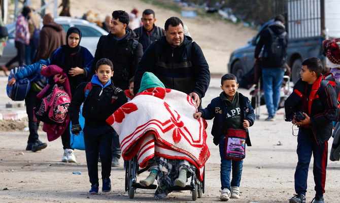 Palestinians fleeing Khan Younis, due to the Israeli ground operation, move towards Rafah, amid the ongoing conflict between Israel and Hamas, in the southern Gaza Strip, January 28, 2024. (Reuters)