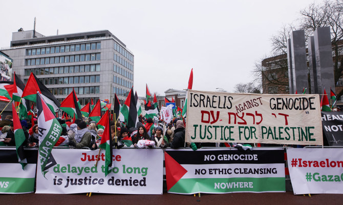 Pro-Palestinian protesters gather near the International Court of Justice in The Hague, Netherlands January 12, 2024. (Reuters)