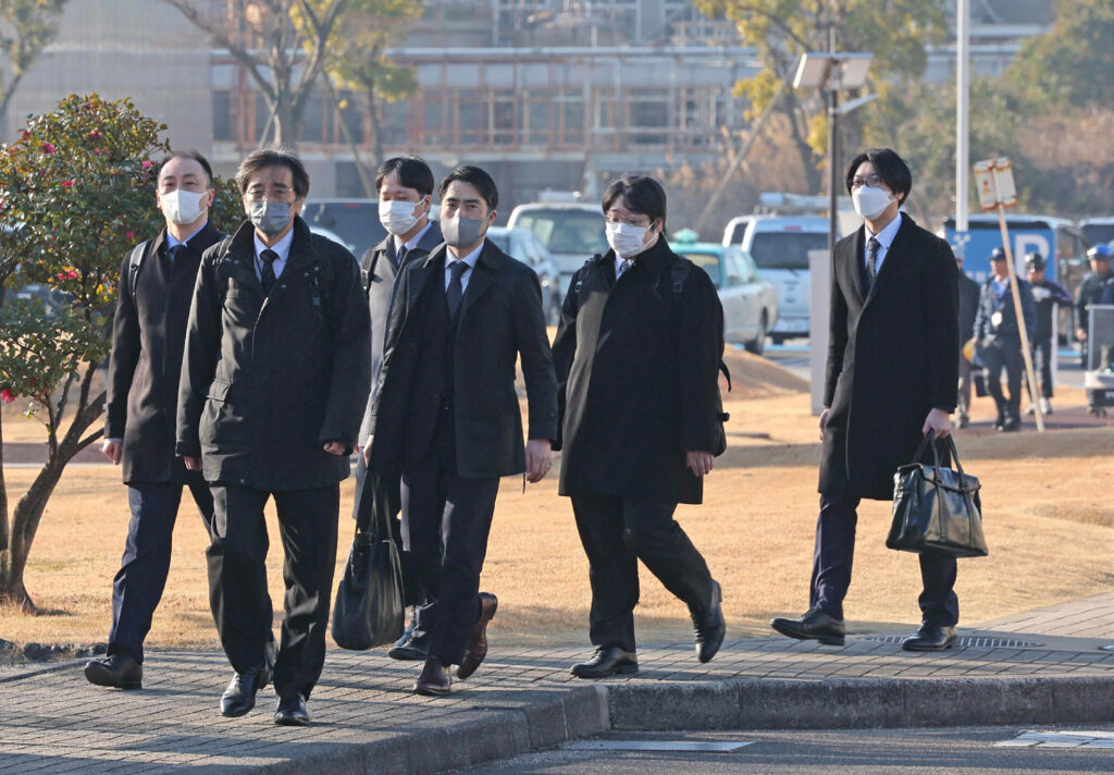 Officials from the Ministry of Land, Infrastructure, Transport and Tourism enter Toyota Industries' Hekinan factory for an inspection in Hekinan, Aichi prefecture on Jan. 30. (AFP)